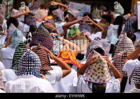 Philippines. 30th July, 2015. Thousand students of Sta. Elena High School in Marikina City joined to the Metro wide earthquake drill and covered their head by a rug in preparations for the “Big One” an earthquake possible it may happen because of the maturity of Marikina Fault Line Quake also known as the Valley Fault System (VFS) according to Philippine Institute of Volcanology and Seismology (PHIVOLCS). Credit:  Gregorio B. Dantes Jr./Pacific Press/Alamy Live News Stock Photo