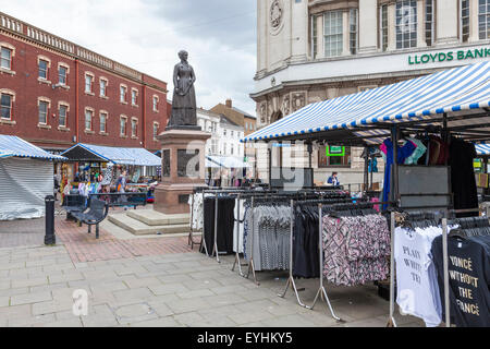 Market stalls and the statue of Sister Dora in Walsall town centre. Walsall Market Place, Walsall, West Midlands, England, UK Stock Photo