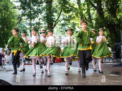 Dancing childrens in national costumes at the Latvian National Song and Dance Festival Stock Photo
