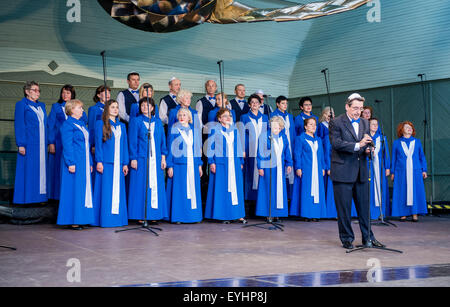 Singing people in national costumes at the Latvian National Song and Dance Festival Stock Photo