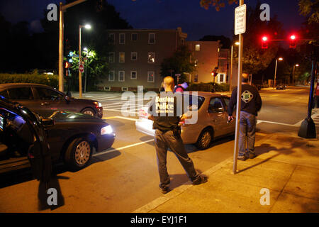 Plain clothed Boston Police Department cops stop a vehicle and speak to the driver late at night, Boston, Massachusetts, USA Stock Photo