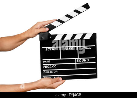 closeup of a young man about to clap a traditional wooden clapperboard against a white background Stock Photo