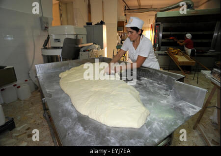 Italy, Basilicata, Roccanova, bakery, baker kneading bread Stock Photo