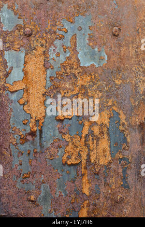 Close-up of a ragged and completely rusty sheet metal plate. Stock Photo