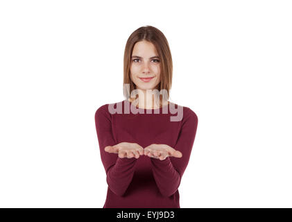 smiling girl in red sweater offers something on the palms Stock Photo