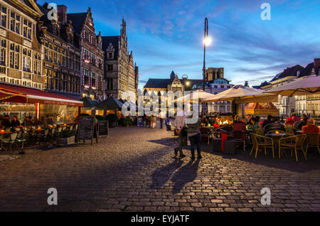 People having dinner in the Graslei in Ghent. The city was illuminated by that time. Stock Photo