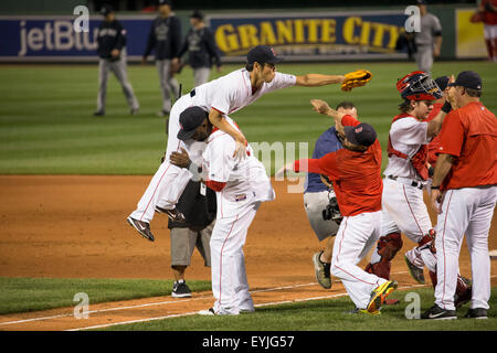 Boston Red Sox catcher David Ross (L-R) relief pitcher Koji Uehara and the  rest of the team celebrate after the final out of Game 6 of the World Series  against the St.