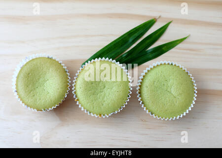 Pandan cupcakes on wooden board Stock Photo