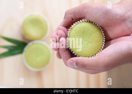 Pandan cupcakes on wooden board Stock Photo