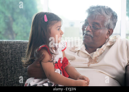 Portrait Indian family at home. Grandparent and grandchild talking together. Asian people living lifestyle. Grandfather and gran Stock Photo