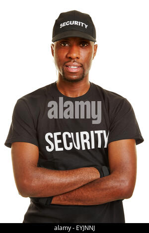 Smiling black man as security guard with his arms crossed Stock Photo