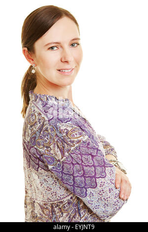 Side view of smiling casual woman with her arms crossed Stock Photo