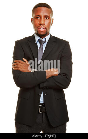 African businessman smiling with his arms crossed Stock Photo