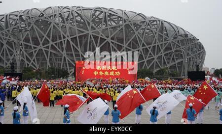 Beijing, China. 31st July, 2015. People gather to celebrate Beijing winning the bid to host the 2022 Olympic Winter Games in front of the National Stadium in Beijing, capital of China, July 31, 2015. Credit:  Li Xin/Xinhua/Alamy Live News Stock Photo