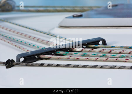 Details of sailing boat. Color ropes on white deck Stock Photo