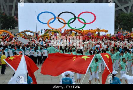 Beijing, China. 31st July, 2015. People gather to celebrate at the Olympic Green in Beijing, capital of China, July 31, 2015. Beijing, together with its neighbor city Zhangjiakou, won the bid to host the 2022 Olympic Winter Games. Credit:  Guo Yong/Xinhua/Alamy Live News Stock Photo