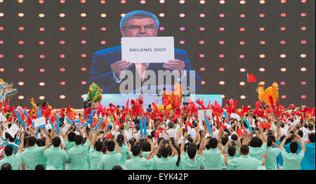 Beijing, China. 31st July, 2015. People gather to celebrate at the Olympic Green in Beijing, capital of China, July 31, 2015. Beijing, together with its neighbor city Zhangjiakou, won the bid to host the 2022 Olympic Winter Games. Credit:  Xie Huanchi/Xinhua/Alamy Live News Stock Photo