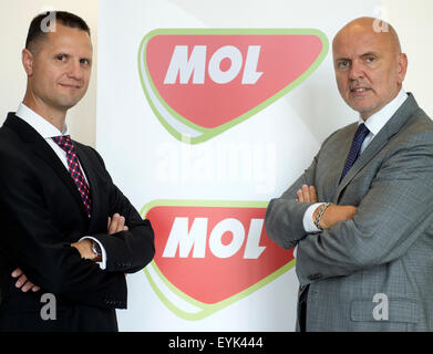 Hungarian oil group MOL wants to become a leader on the Czech filling station market both in terms of the number of filling stations and in terms of the volume of fuel sales, Attila Dsupin, left, MOL's CEO in the Czech Republic, told CTK in Prague, Czech Republic, July 31, 2015. All petrol stations Agip in the Czech Republic and Slovakia will be run by Hungarian oil holding MOL. Pictured right Slovanft CEO Oszkar Vilagi. (CTK Photo/Michal Kamaryt) Stock Photo