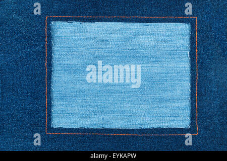 Frame made of dark denim  lies on a light jeans Stock Photo