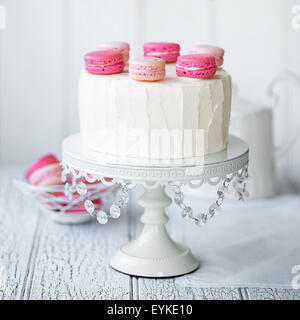 Layer cake decorated with macarons Stock Photo