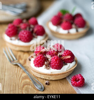 Raspberry tarts with chocolate shavings Stock Photo