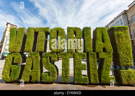 Vitoria Gasteiz vegetable sculpture in grass in Plaza de la Virgen Blanca with Iglesia de San Miguel Arcángel, Vitoria - Gasteiz Stock Photo