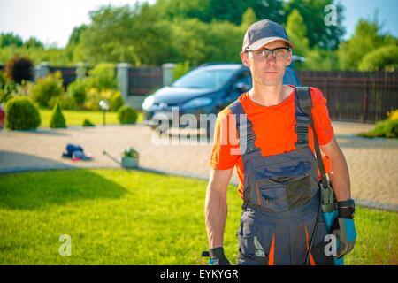 Occupation Professional Gardener. Young Gardener Ready to Get Work. Stock Photo