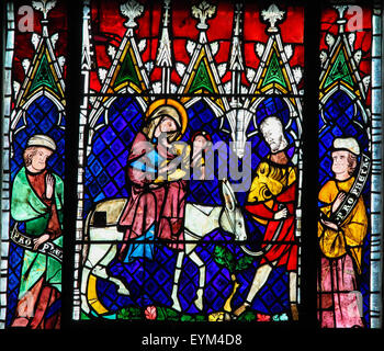 Stained glass depicting the Flight into Egypt in the cathedral of Strasbourg, France Stock Photo