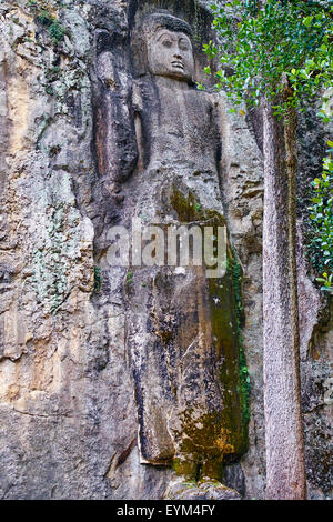 Sri Lanka, Ceylon, Central Province, Ella, Dowa Rock Temple, Buddha statue carved in a rock Stock Photo