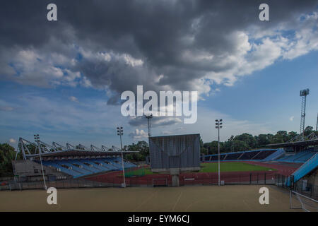 View of an empty Crystal Palace Athletics Stadium in South London with a very dramatic cloudy sky Stock Photo