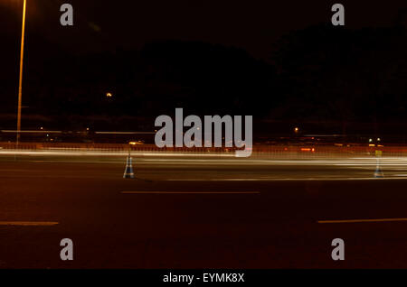 A long exposure of traffic which are going through road. Stock Photo