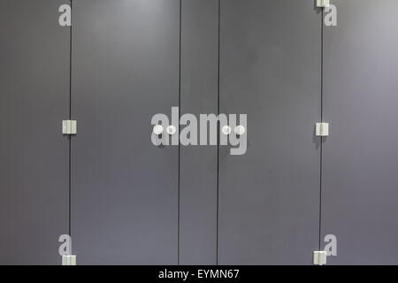 Mens restroom in an public building in gray doors Stock Photo