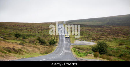 Road crossing moorland near Postbridge, Dartmoor national park, Devon, England, UK Stock Photo