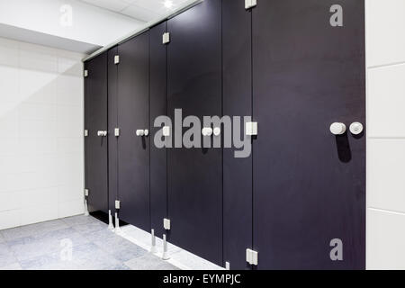 Mens restroom in an public building in black doors Stock Photo