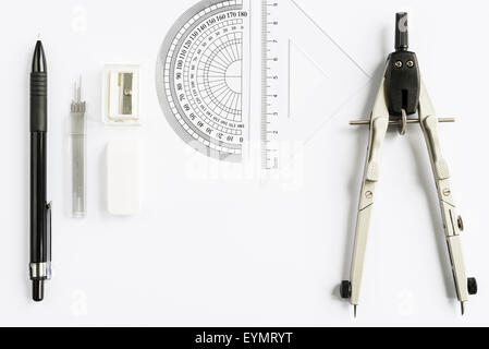 Set of measuring tools with compass, pencil and rulers on white background from above Stock Photo