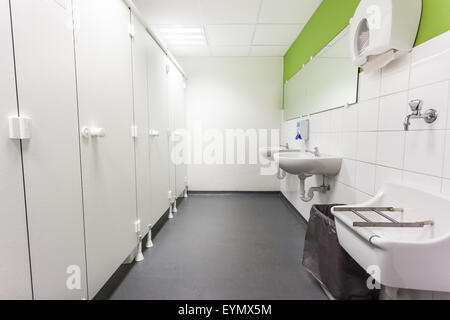 Womans restroom in an public building in white  doors Stock Photo