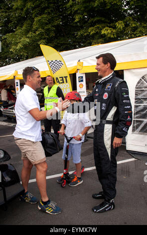 Copenhagen, Denmark, August 1st, 2015. Danish Prince Joachim welcome his co-driver, Le Mans winner and Audi driver Tom Kristensen, to Copenhagen Historic Grand Prix where they participates in the combined amateur and professional class for classic cars. Stock Photo