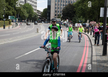 Tower Hill, London, UK, 1st August 2015, A family take part in the Prudential RideLondon FreeCycle Credit: Keith Larby/Alamy Live News Stock Photo