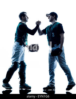 one caucasian men baseball players playing  in studio  silhouette isolated on white background Stock Photo