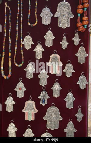 Fatima silver hands in Fez market, Morocco Stock Photo