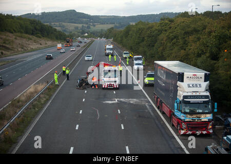 Emergency services attend a traffic accident that completely closed the southbound carriageway of the M5 on Saturday evening as thousands of holiday makers headed towards the South West coastal resorts. The incident occurred alongside Michaelwood Services - Police diverted traffic off the motorway, through the service area to rejoin the M5. Photo: South West Photos, Alamy Live News Stock Photo