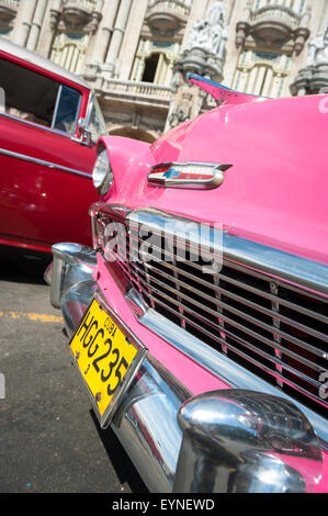 HAVANA, CUBA - JUNE 13, 2011: Colorful vintage American cars stand parked in Central Havana. Stock Photo