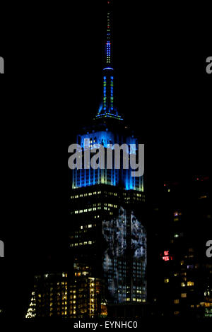 New York City, USA. 1st Aug, 2015. Digital images of endangered species are projected onto the south face of New York City's Empire State Building on Saturday evening.  The project, entitled #racingextinction, is the brainchild of filmmaker and photographer Louis Psihoyos and multimedia artist Travis Threlkel, and is designed to raise awareness of the plight of threatened creatures.  The collaborators refer to it as a 'weapon of mass instruction.'  The images were projected using 40 projectors of 20,000 lumens each. Credit:  Adam Stoltman/Alamy Live News Stock Photo