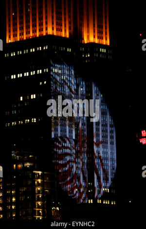 New York City, USA. 1st Aug, 2015. Digital images of endangered species are projected onto the south face of New York City's Empire State Building on Saturday evening.  The project, entitled #racingextinction, is the brainchild of filmmaker and photographer Louis Psihoyos and multimedia artist Travis Threlkel, and is designed to raise awareness of the plight of threatened creatures.  The collaborators refer to it as a 'weapon of mass instruction.'  The images were projected using 40 projectors of 20,000 lumens each. Credit:  Adam Stoltman/Alamy Live News Stock Photo