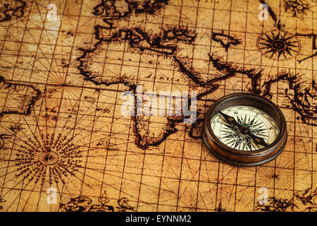 Old vintage compass on ancient map Stock Photo