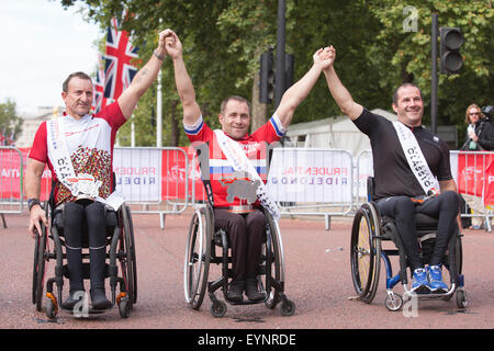 London, UK. 2 August 2015. Prudential RideLondon 2015. Winners of the Handcycle Classic race L-R: Alan Cook (3rd), Brian Alldis (1st), Chris Madden (2nd). Photo: OnTheRoad/Alamy Live News
