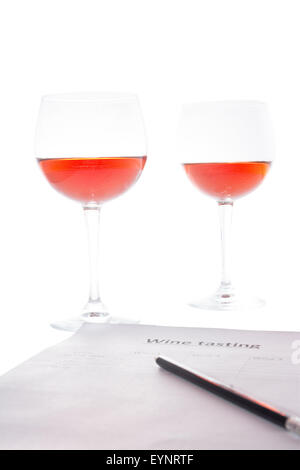 examination of the wine and notes the results Stock Photo