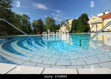 Luxury resort in Hungary, in the foreground turquoise pool for guests. Stock Photo