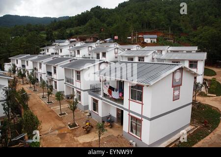 Zhaotong, Ludian earthquake one year ago in Qiaojia County. 3rd Aug, 2014. Photo taken on July 31, 2015 shows a resettlement community for victims of the Ludian earthquake one year ago in Qiaojia County, southwest China's Yunnan Province. A 6.5-magnitude earthquake jolted Ludian County in Yunnan at 4:30 p.m. on Aug. 3, 2014. As one year has passed, the post-disaster reconstruction for the quake victims has been pushing forward orderly. Credit:  Zhang Guangyu/Xinhua/Alamy Live News Stock Photo