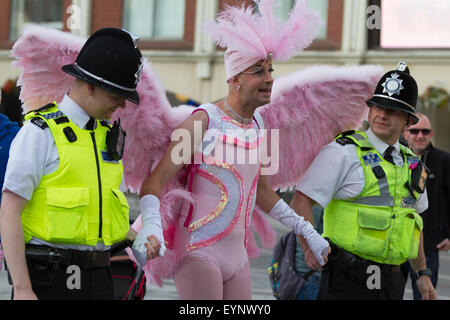 Stockton-on-Tees, UK, Saturday, 1st August, 2015. A male street performer, in full costume as a pink angel, interacts with two officers from Cleveland Police, dressed in their normal police uniform, at Instant Light, the 28th Stockton International Riverside Festival. Stock Photo